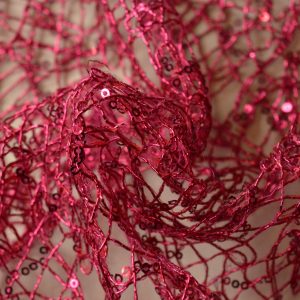 Opengewerkte paillettenstof - Roze